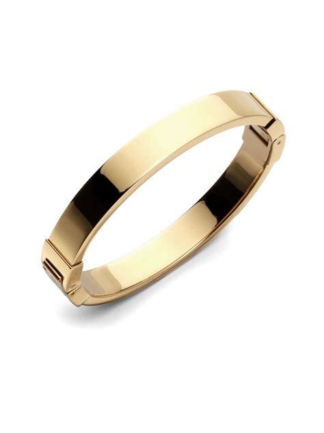 michael kors luxe goldtone crisscross hinged bangle bracelet|Michael Kors stainless steel bracelet.